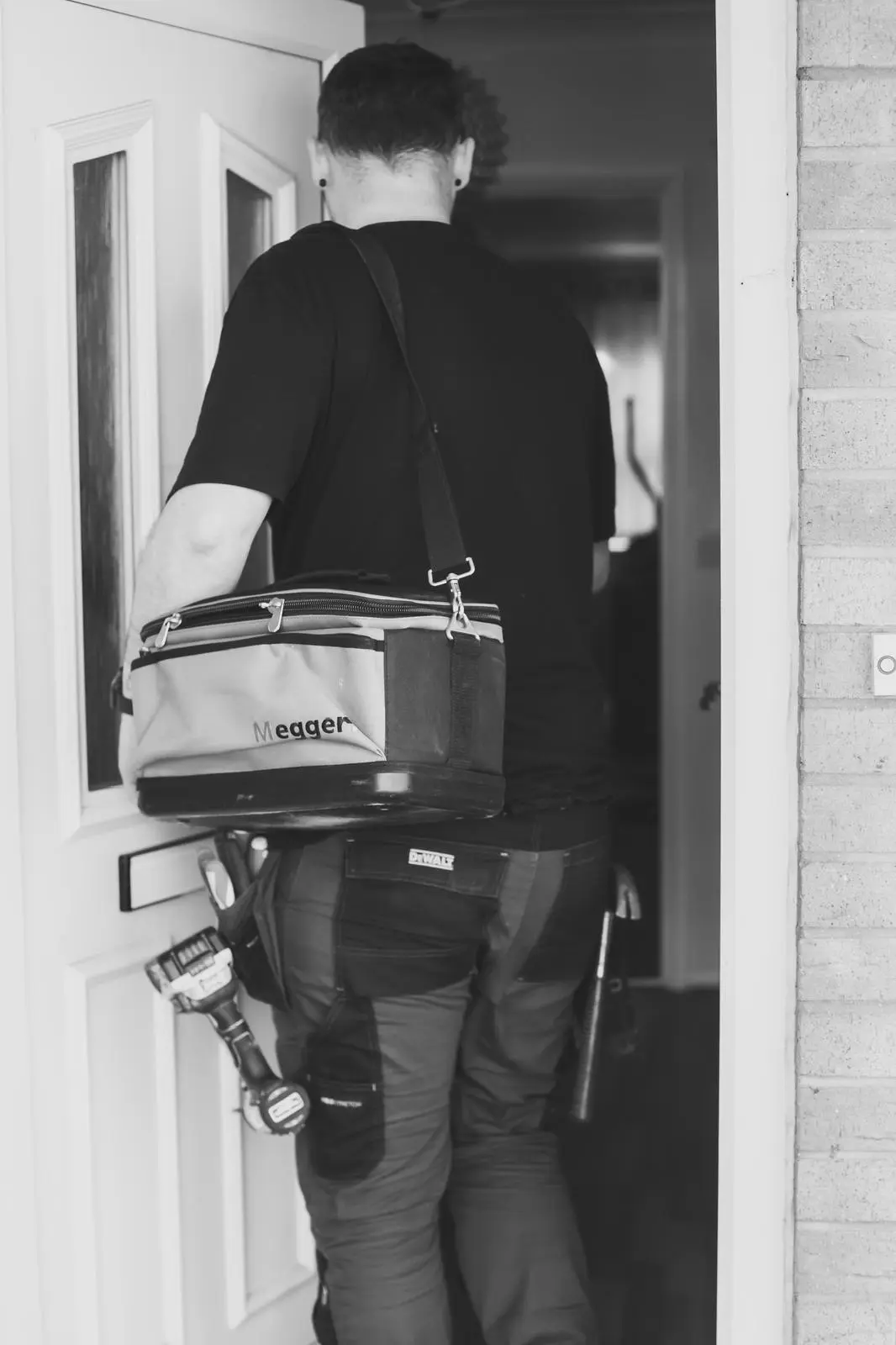 JDH electrician entering a property with tools