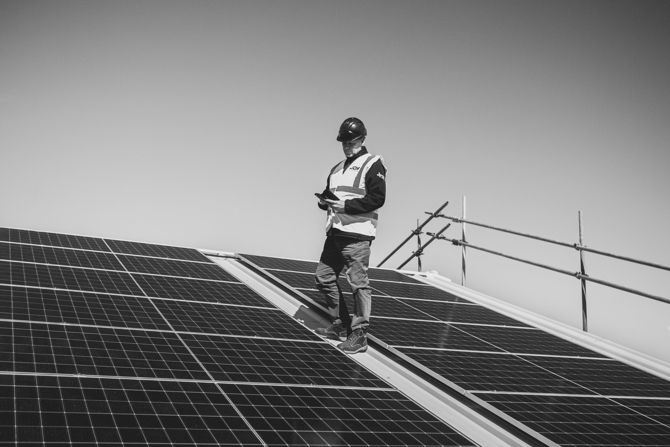 JDH engineer assessing solar PV infrastructure that can be considered with EV charging